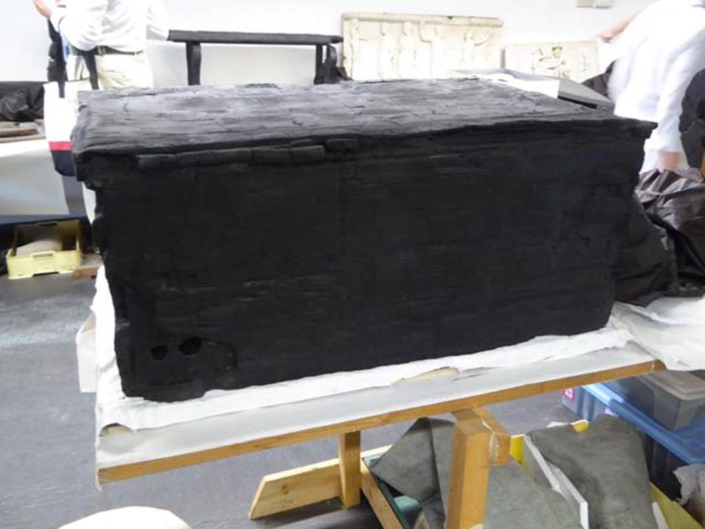 Decumanus Maximus, Herculaneum, September 2016. Rear of carbonised wooden arca/strong box.
Photo courtesy of Michael Binns.